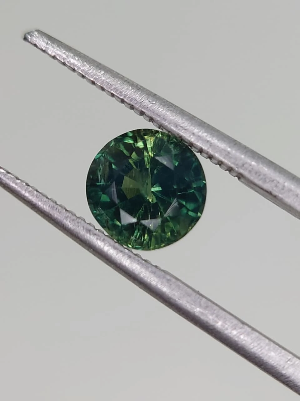 1.3ct Bluish Green Natural Round Faceted Sapphire from Nigeria — view 3